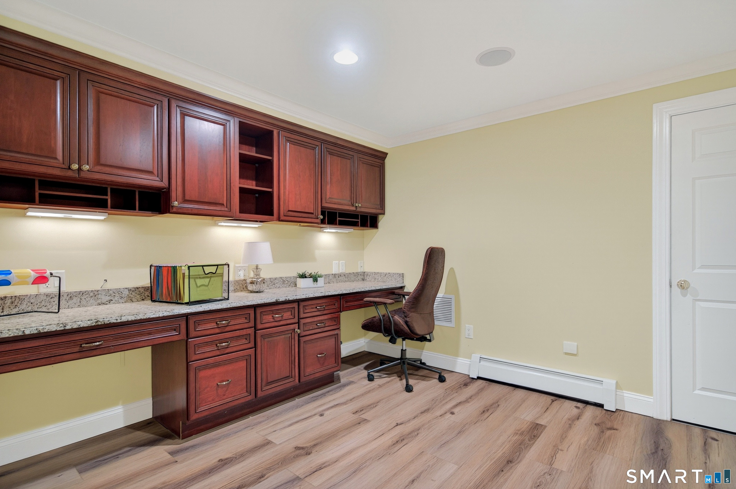 16 Farm Meadow Road Newtown, CT 06470 - Photo 25 of 40 Additional finished lower-level office or craft area with custom cabinetry, granite counters, and ample storage.
