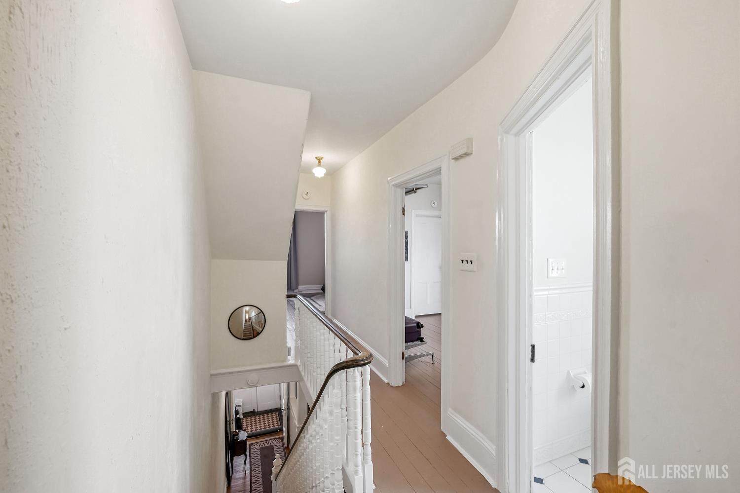 346 East Union Street Burlington, NJ 08016 - Photo 20 of 48 a view of a bathroom with a shower and a mirror