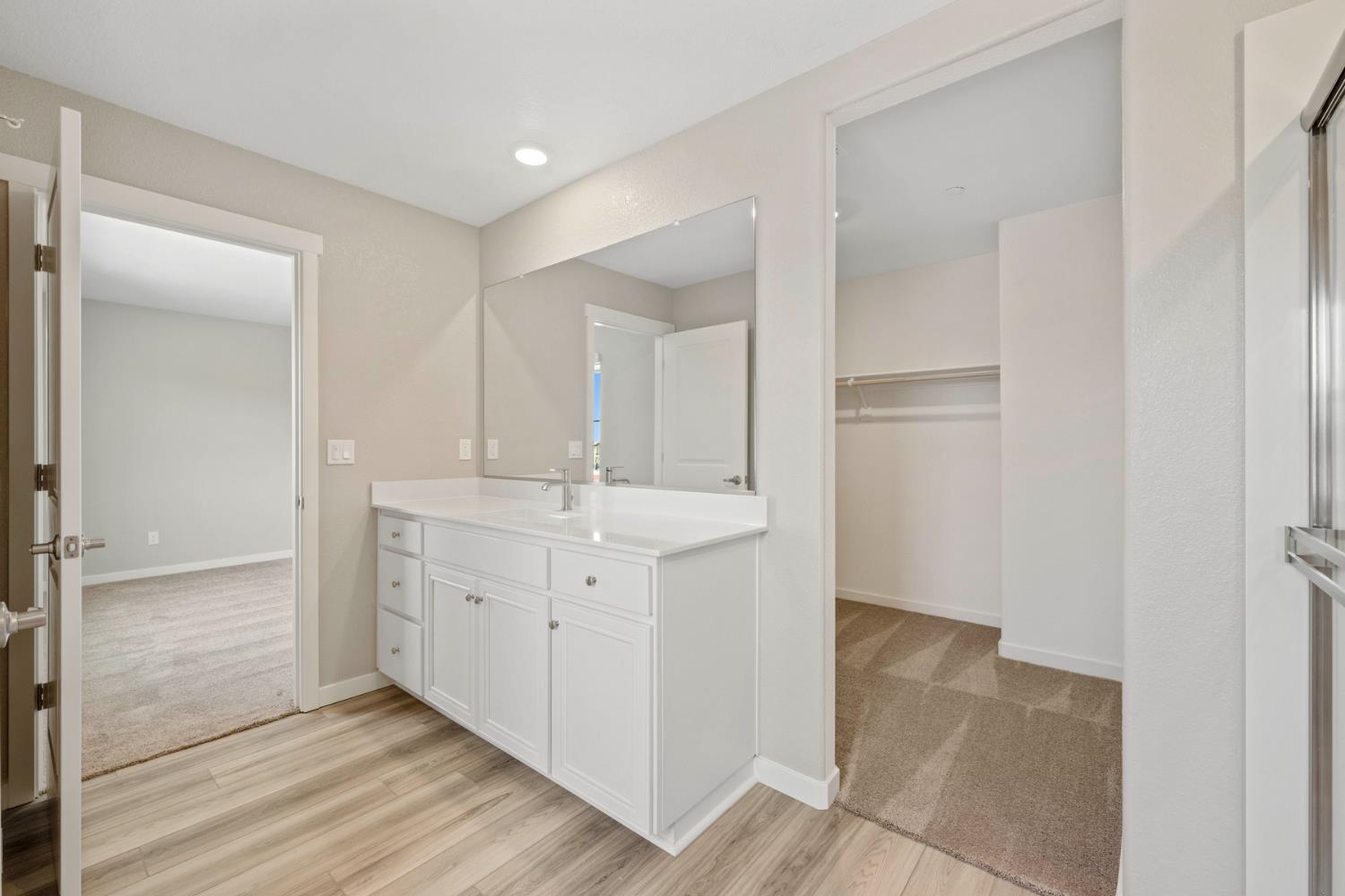 2979 Bowery Lane Lincoln, CA 95648 - Photo 15 of 19 a bathroom with a sink and a mirror