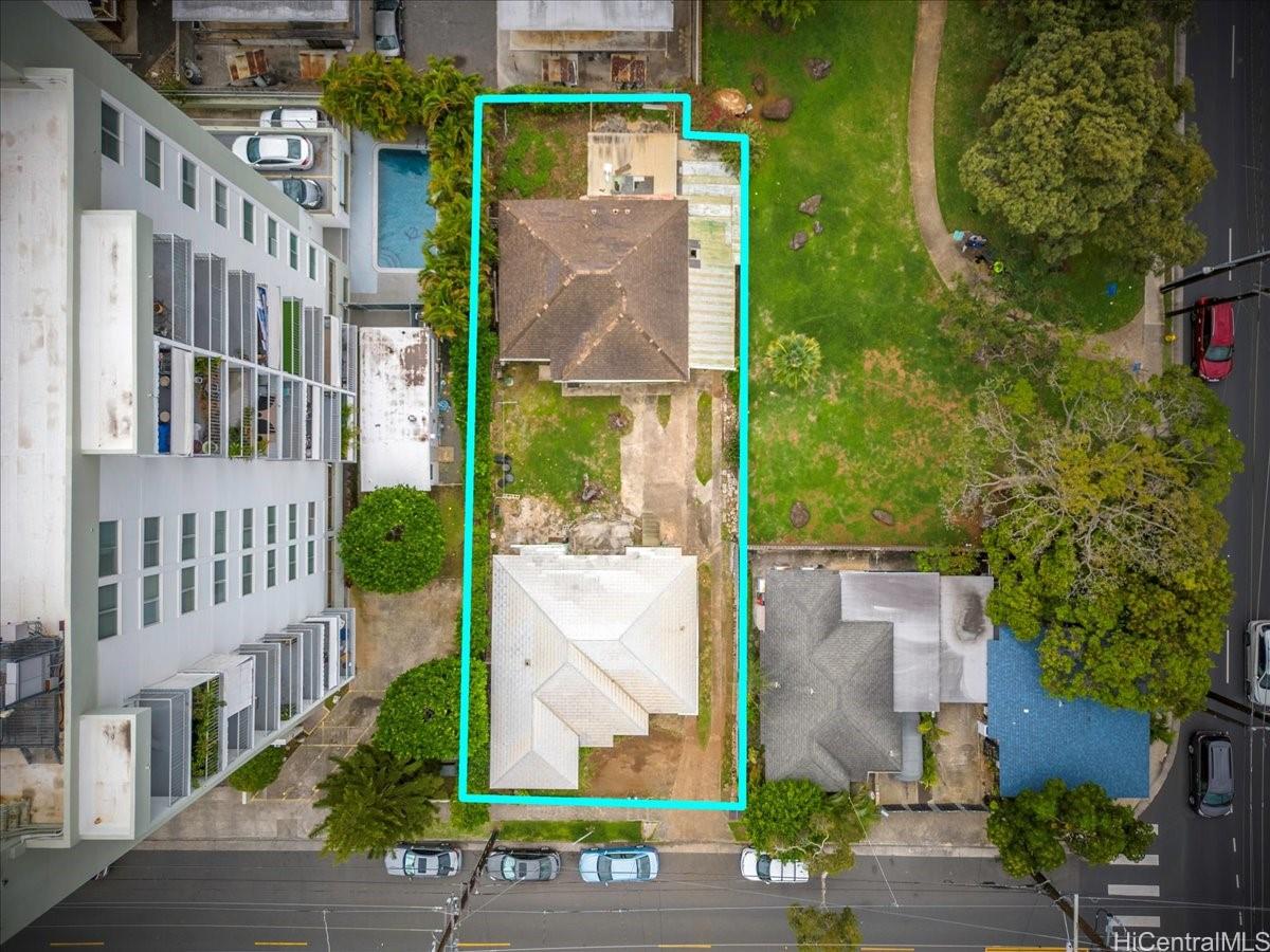 2011 Lime Street Honolulu, HI 96826 - Photo 1 of 1 front view of a brick building next to a yard