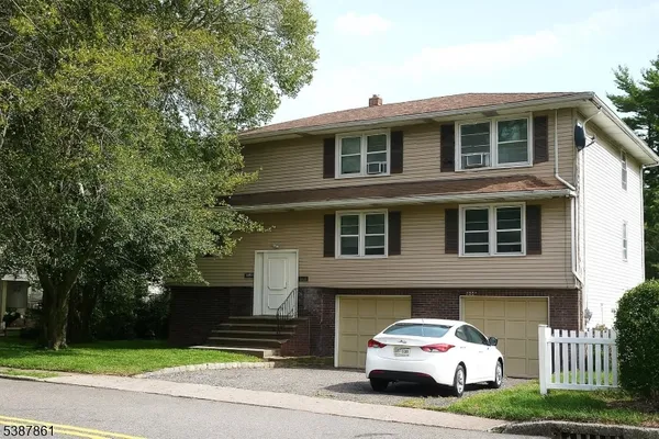 a car parked in front of a house