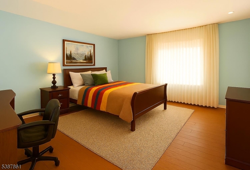 85 Grove Street South Hackensack, NJ 07606 - Photo 11 of 32 a bedroom with a bed and a chair