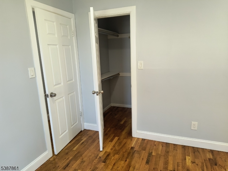 85 Grove Street South Hackensack, NJ 07606 - Photo 14 of 32 a view of front door with wooden floor
