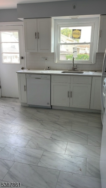 85 Grove Street South Hackensack, NJ 07606 - Photo 22 of 32 a kitchen with a sink and cabinets