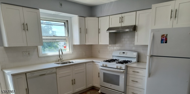 85 Grove Street South Hackensack, NJ 07606 - Photo 24 of 32 a kitchen with stainless steel appliances a white cabinets and a sink