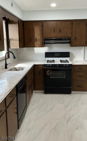 85 Grove Street South Hackensack, NJ 07606 - Photo 25 of 32 a kitchen with stainless steel appliances granite countertop a stove a sink and a microwave