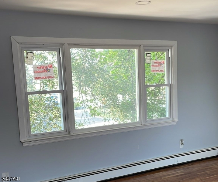 85 Grove Street South Hackensack, NJ 07606 - Photo 3 of 32 a view of a room that has a window in it