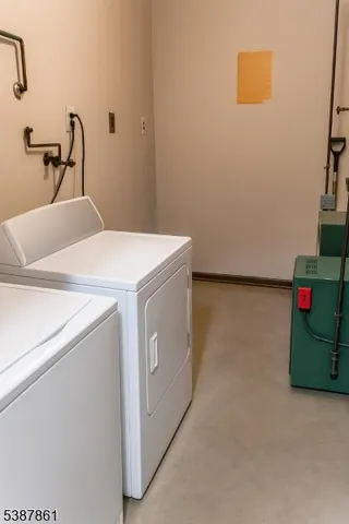 a view of a house with a yard and furniture