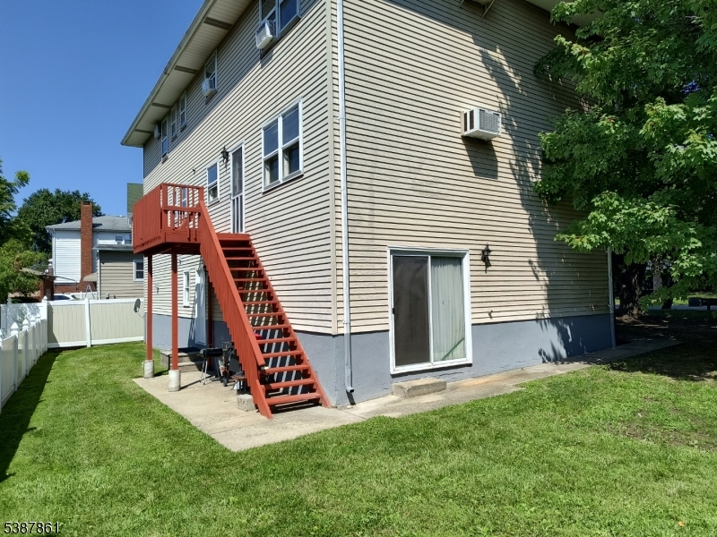 85 Grove Street South Hackensack, NJ 07606 - Photo 32 of 32 a view of a house with a yard and furniture