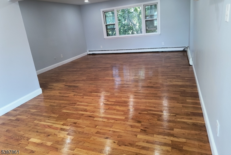 85 Grove Street South Hackensack, NJ 07606 - Photo 4 of 32 a view of empty room with window