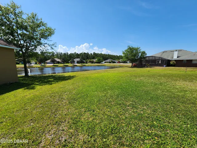a view of a swimming pool and an outdoor seating