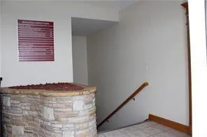 a view of a room with a table and chairs