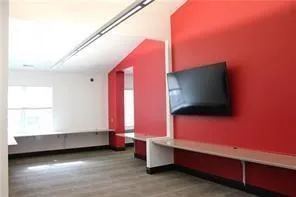 a view of a hallway with seating area