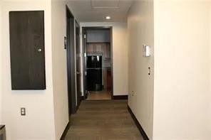 a view of room with window and wooden floor