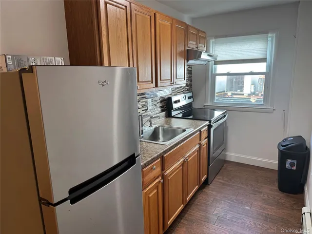 a kitchen with stainless steel appliances a refrigerator and a sink