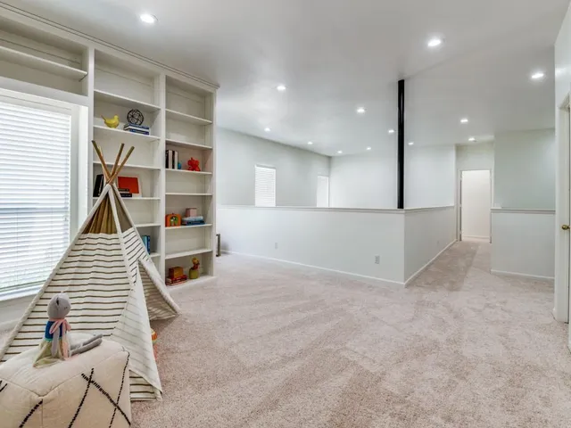 an empty room with wooden floor and closet