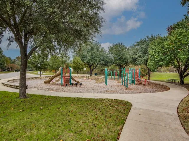 a view of a park with swings