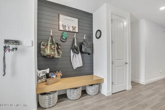 a room with wooden floor and shoes
