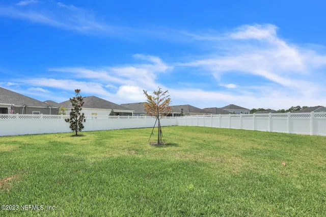 a lake view with a big yard
