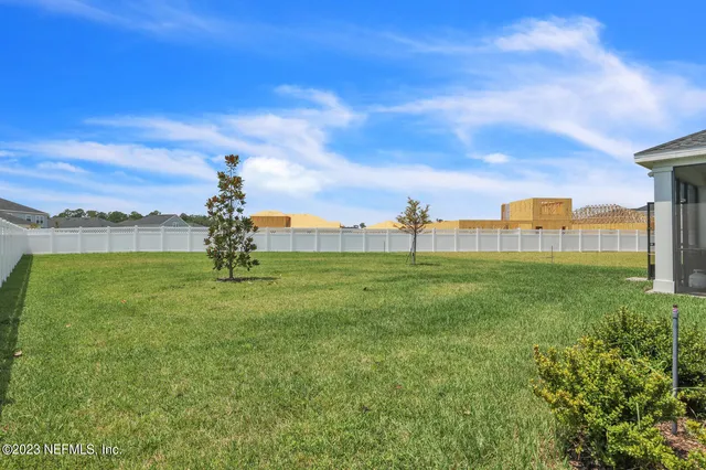 a view of a field with grass