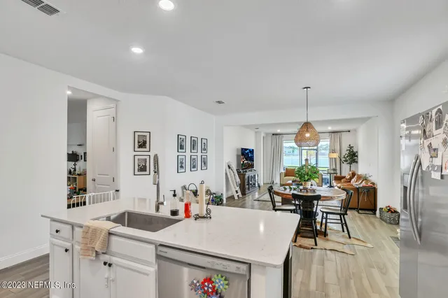 a view of a dining room with furniture and window