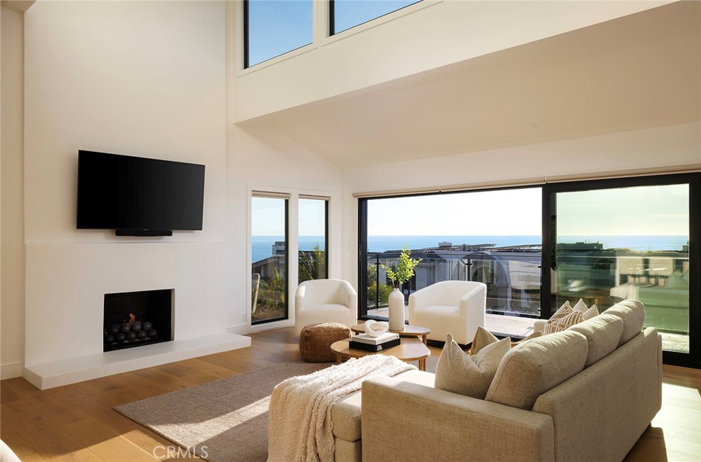 630 Loretta Drive Laguna Beach, CA 92651 - Photo 13 of 75 a living room with fireplace furniture and a flat screen tv
