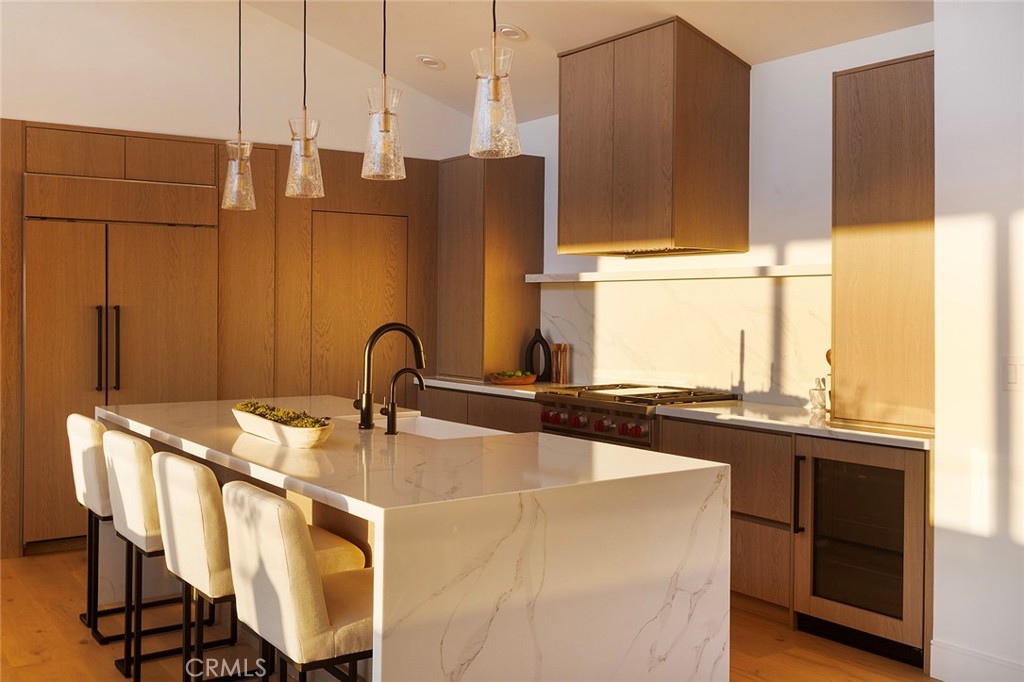 630 Loretta Drive Laguna Beach, CA 92651 - Photo 24 of 75 a kitchen with stainless steel appliances granite countertop a sink a stove and a refrigerator