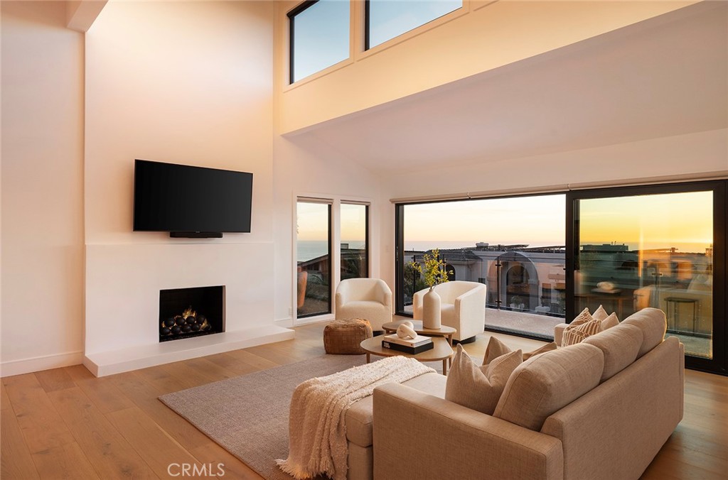 630 Loretta Drive Laguna Beach, CA 92651 - Photo 25 of 75 a living room with fireplace furniture and a flat screen tv