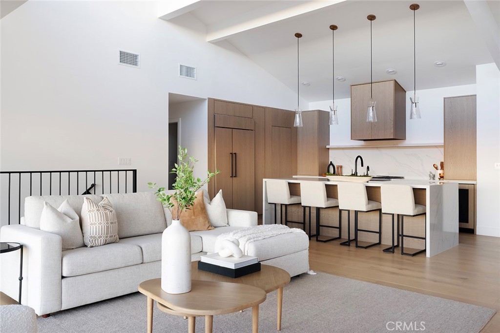 630 Loretta Drive Laguna Beach, CA 92651 - Photo 26 of 75 a living room with furniture kitchen view and a wooden floor