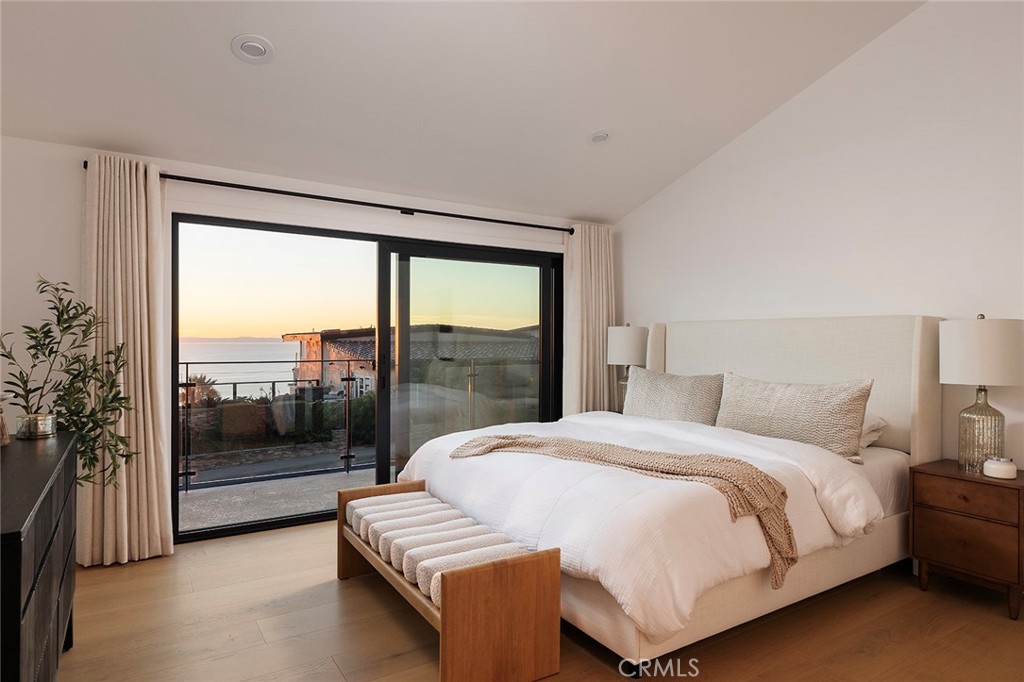 630 Loretta Drive Laguna Beach, CA 92651 - Photo 32 of 75 a bedroom with a large bed and a balcony view