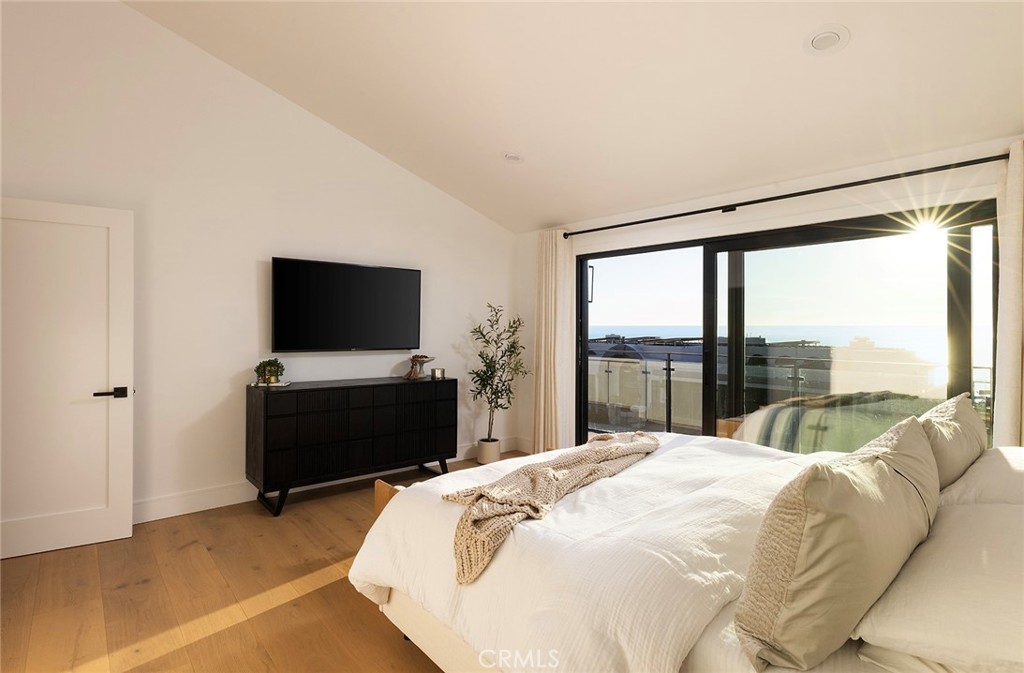 630 Loretta Drive Laguna Beach, CA 92651 - Photo 33 of 75 a bedroom with a bed and a flat screen tv