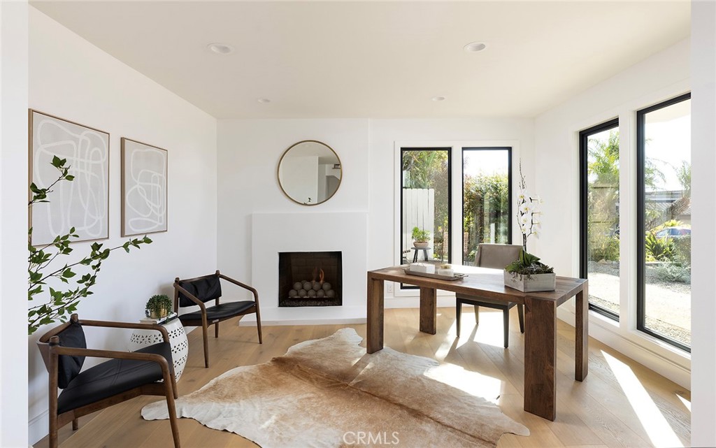 630 Loretta Drive Laguna Beach, CA 92651 - Photo 39 of 75 a living room with furniture a fireplace and a large window