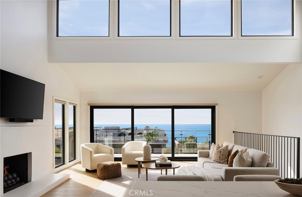 630 Loretta Drive Laguna Beach, CA 92651 - Photo 4 of 75 a living room with furniture tv and large windows