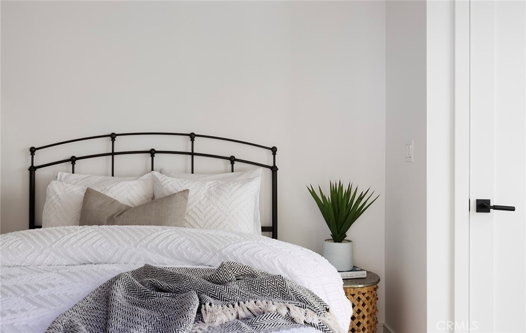 630 Loretta Drive Laguna Beach, CA 92651 - Photo 43 of 75 a bedroom with a bed and a potted plant