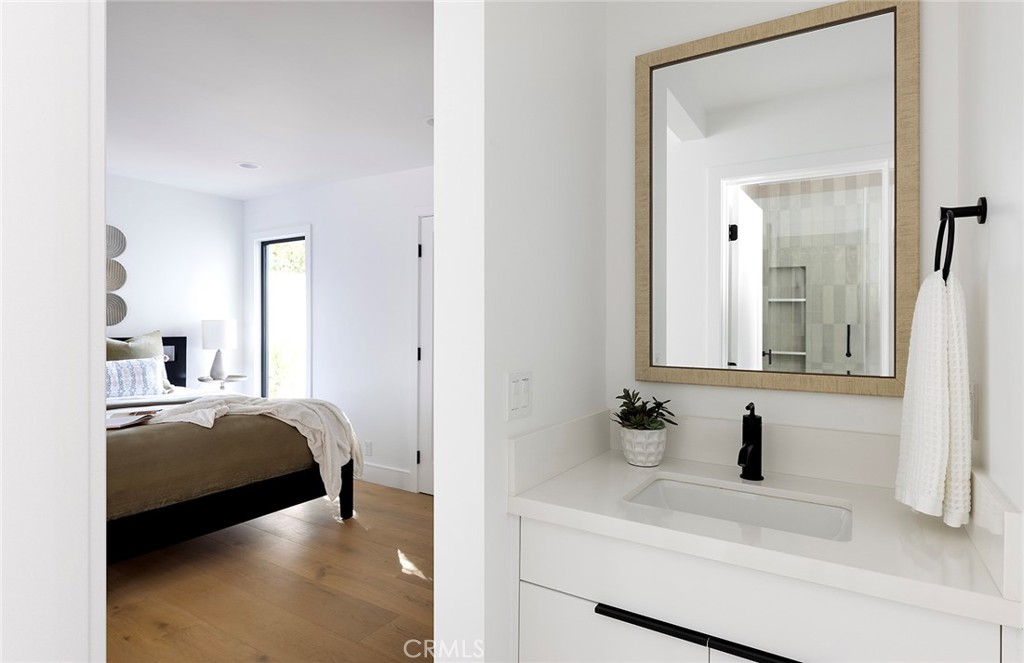 630 Loretta Drive Laguna Beach, CA 92651 - Photo 47 of 75 a en suite bathroom with a sink and a mirror