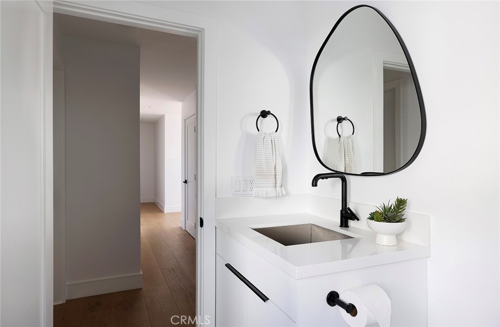 630 Loretta Drive Laguna Beach, CA 92651 - Photo 50 of 75 a bathroom with a sink and a mirror