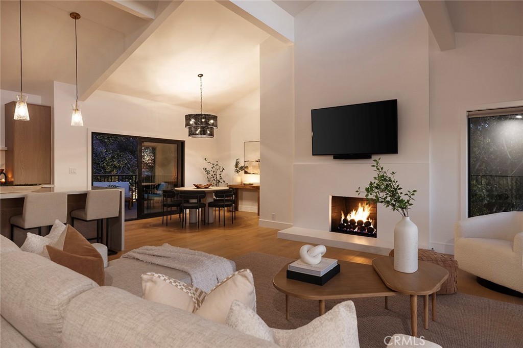 630 Loretta Drive Laguna Beach, CA 92651 - Photo 53 of 75 a living room with furniture a flat screen tv and kitchen view