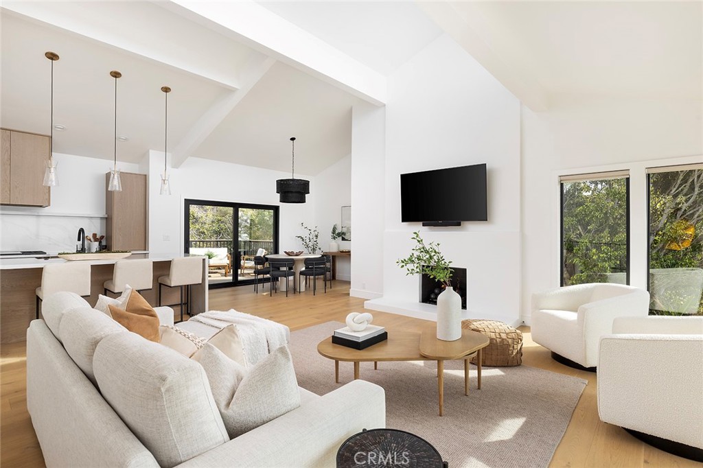630 Loretta Drive Laguna Beach, CA 92651 - Photo 10 of 75 a living room with furniture a flat screen tv and a large window