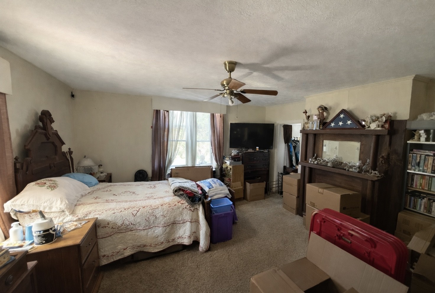 820 State Rte 52 Portland, TN 37148 - Photo 8 of 12 a bedroom with bed and a flat tv screen on dresser