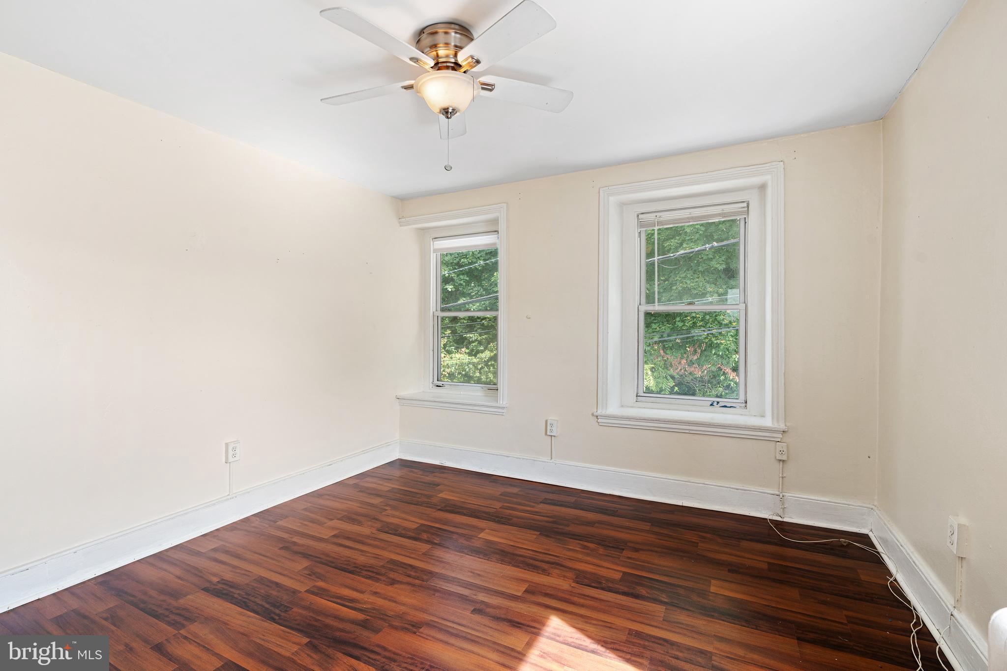4550 Silverwood Street Philadelphia, PA 19127 - Photo 5 of 15 an empty room with wooden floor and window