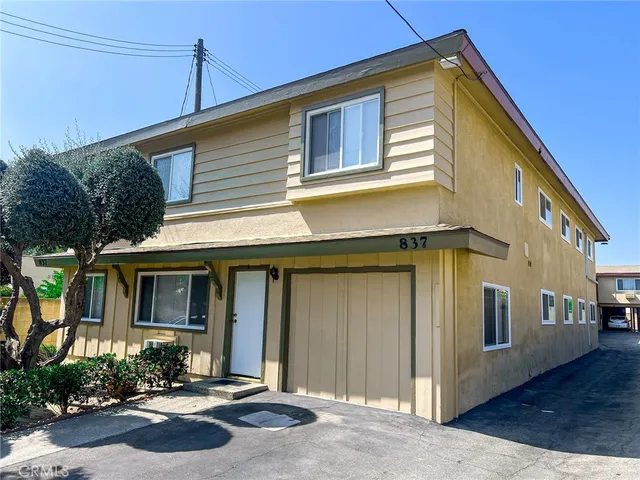 a front view of a house with yard