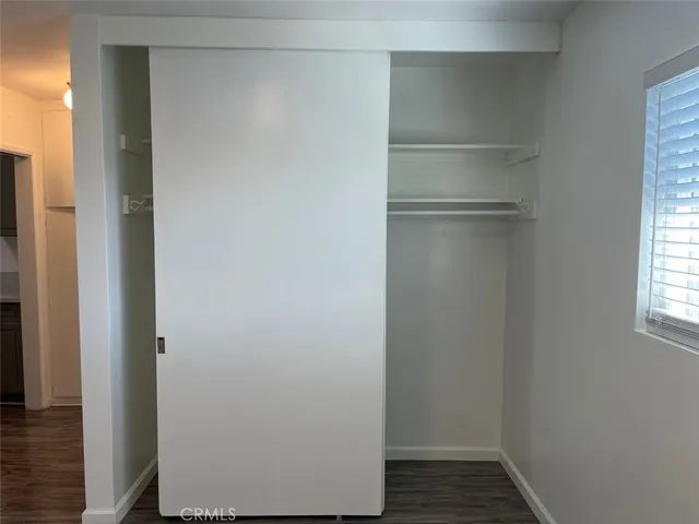 a view of walk in closet with window