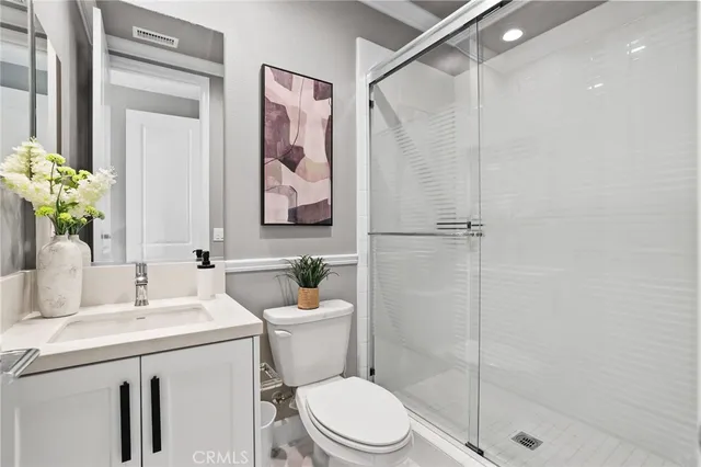 a bathroom with a toilet sink and shower