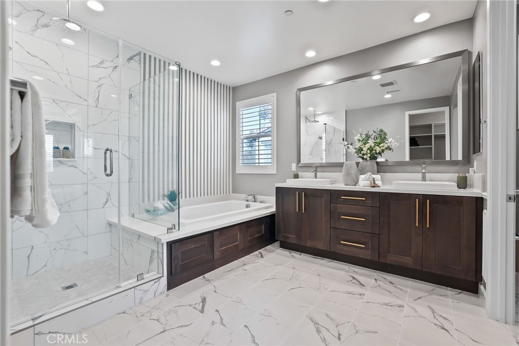 1213 Providence Loop Placentia, CA 92870 - Photo 27 of 43 a bathroom with a tub sink shower and mirror
