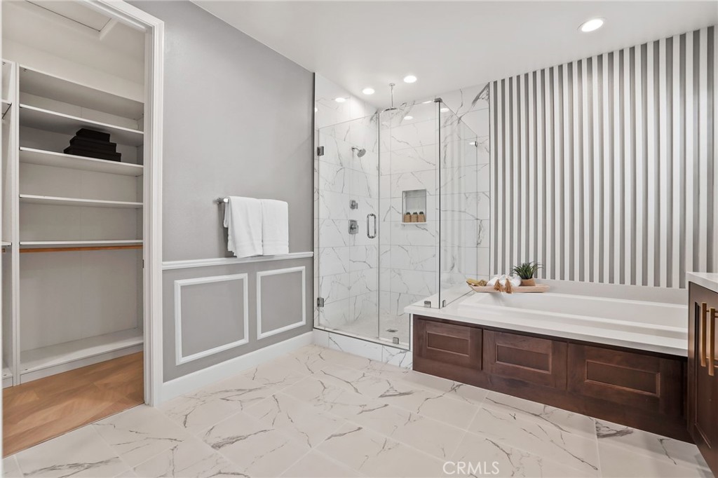 1213 Providence Loop Placentia, CA 92870 - Photo 30 of 43 a spacious bathroom with a double vanity sink a mirror and a bathtub