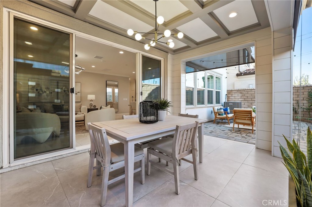 1213 Providence Loop Placentia, CA 92870 - Photo 37 of 43 a view of a dining room with furniture and a chandelier