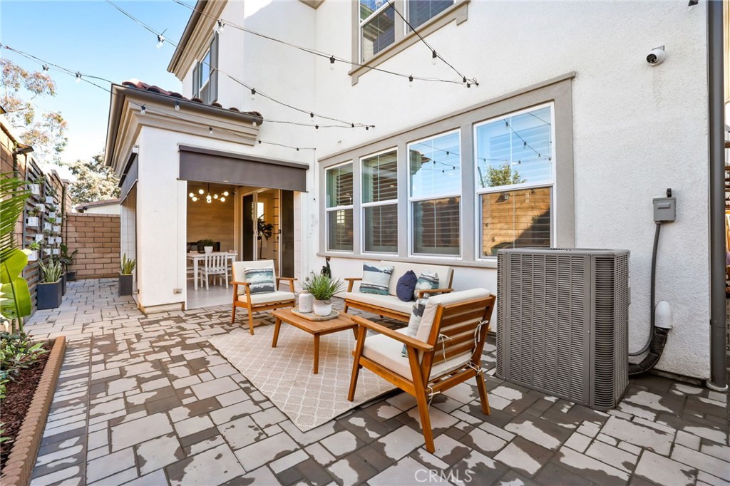 1213 Providence Loop Placentia, CA 92870 - Photo 38 of 43 a building outdoor space with patio furniture and potted plants