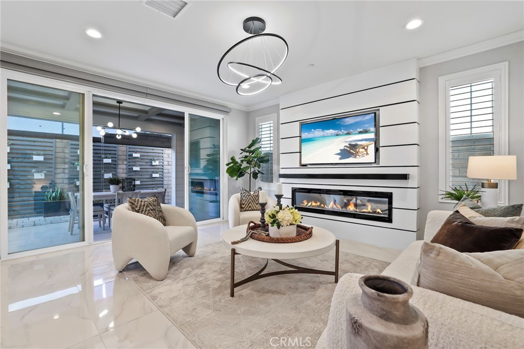 1213 Providence Loop Placentia, CA 92870 - Photo 5 of 43 a living room with furniture potted plant and a fireplace