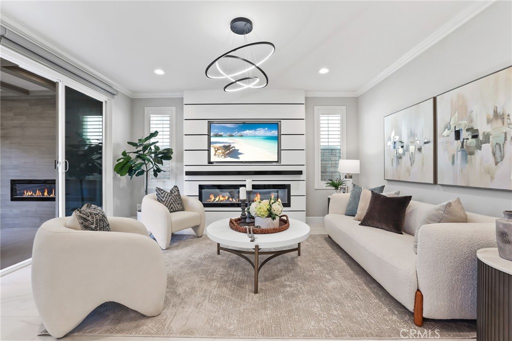 1213 Providence Loop Placentia, CA 92870 - Photo 6 of 43 a living room with furniture a fireplace and a large window