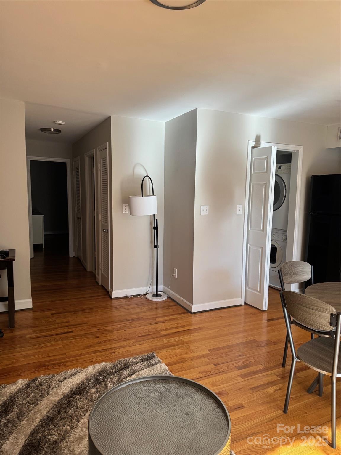 400 Queens Road Charlotte, NC 28207 - Photo 4 of 15 a view of a livingroom with furniture and an empty room